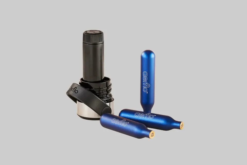 Aerflo Hydro Flask carbonator lid attached to a Hydro Flask bottle, showing the sleek design and a subtle stream of bubbles. - Product Review