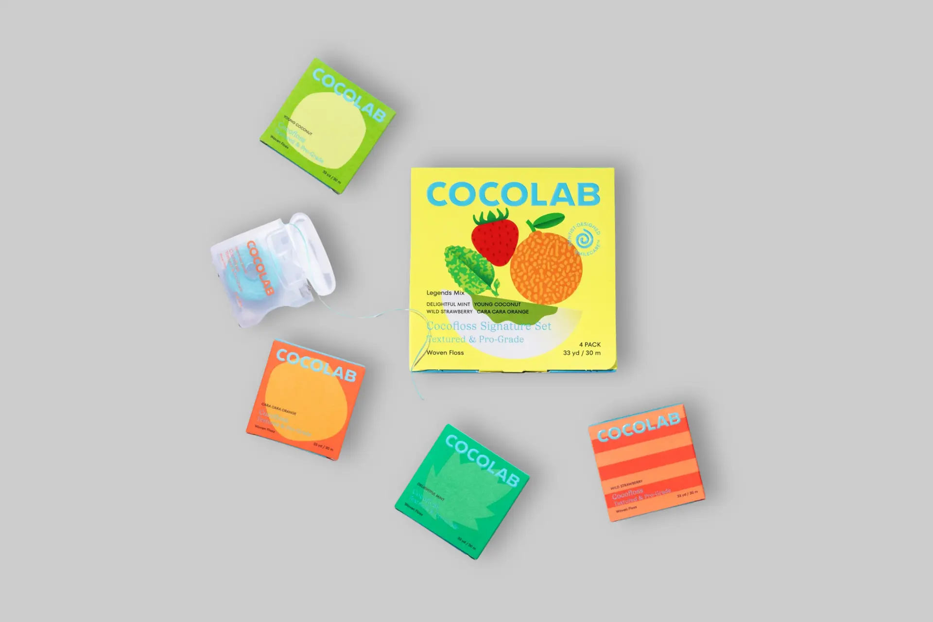 A Cocolab Cocofloss 4-piece gift set, showcasing four colorful spools of floss in a stylish package, highlighting natural flavors and textured weave. - Product Review