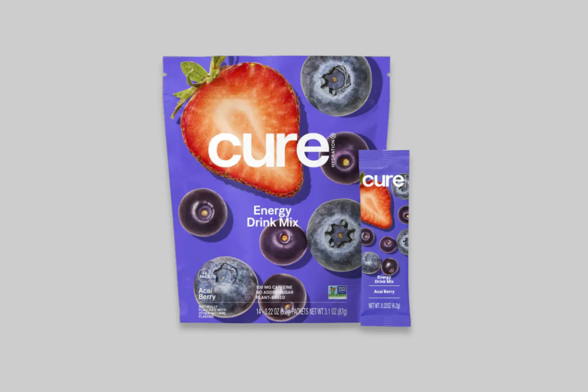 A vibrant glass of CURE Acai Berry Hydration Mix with a packet next to it, showcasing the natural ingredients and refreshing color. - Product Review