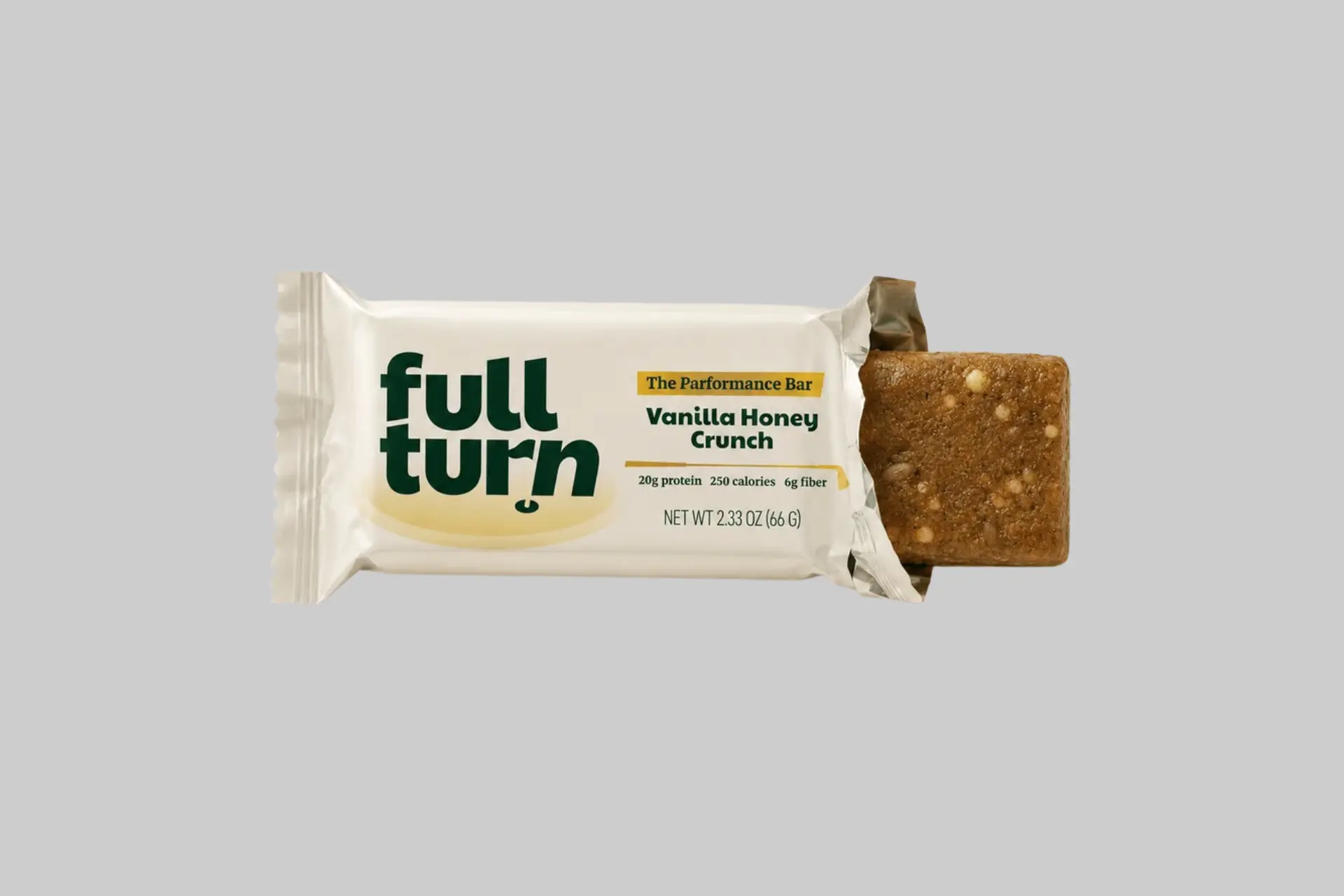 Full Turn Nutrition Performance Bars in Vanilla Honey Crunch and Peanut Butter Cacao flavors, showing the bar's texture and packaging against a golf course background.