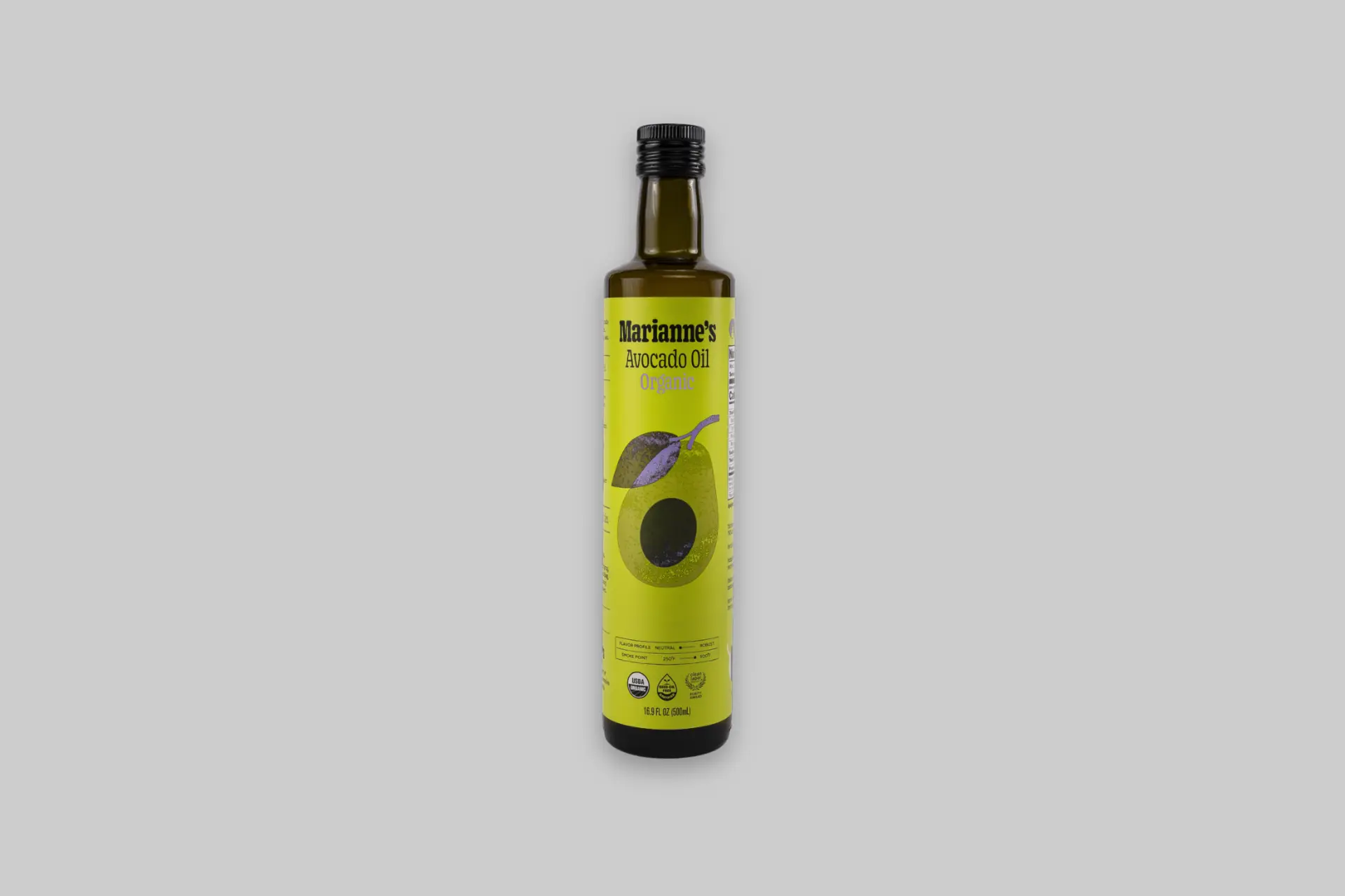 A brown glass bottle of Marianne's Harvest Organic Avocado Oil on a purple background, showing the front label with USDA Organic and Clean Label Project Purity Award badges. - Product Review