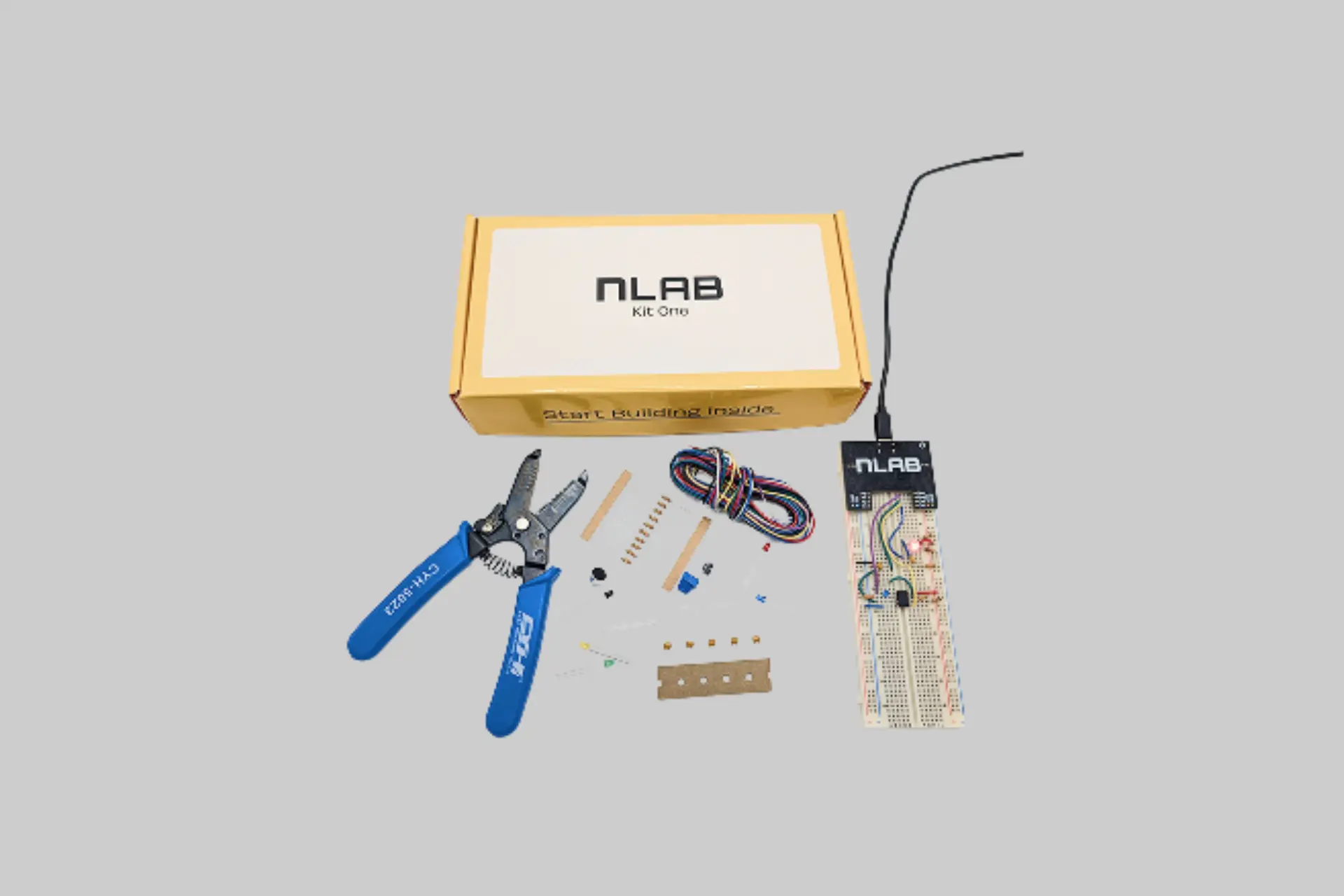 nLab All-in-One Electronics Lab Kit with portable lab device, breadboard, electronic components, and companion app displaying real-time circuit data.