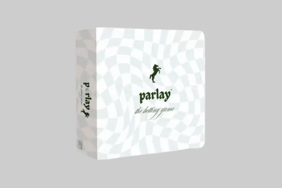 Players engaged in a game of Parlay The Betting Game, featuring stylish vintage-inspired cards and betting chips. - Product Review