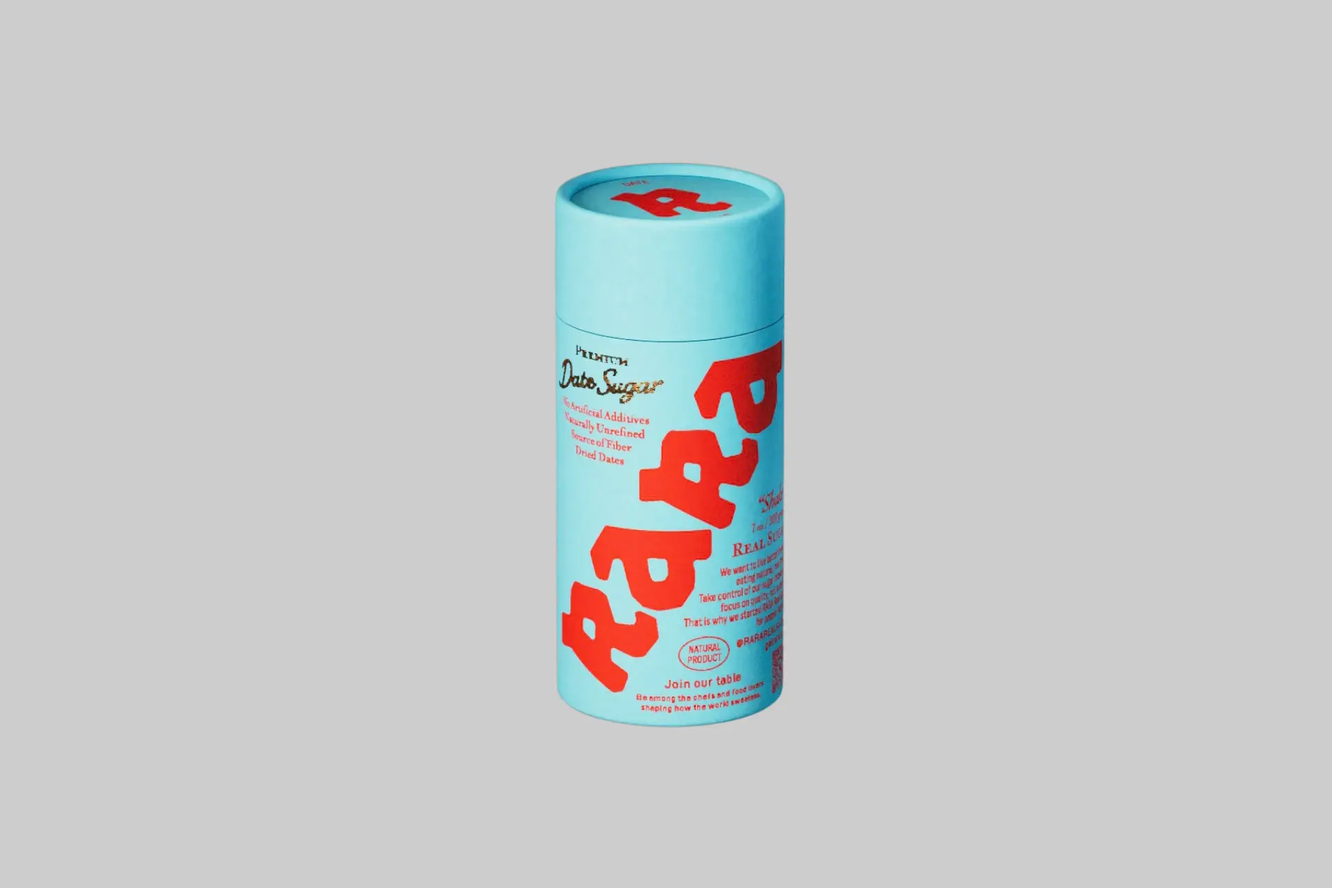 The RARA Real Sugar Date Sugar Shake Tube, a 7oz paper-based shaker tube against a warm background, showing the brand's clean label design and date sugar contents.