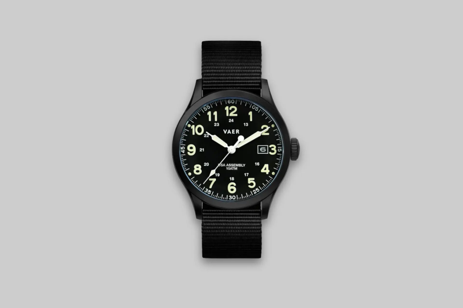 A close-up of the Vaer C5 Tactical Field 40mm USA Solar watch on a wrist, showcasing its durable case, clear dial, and NATO strap. - Product Review