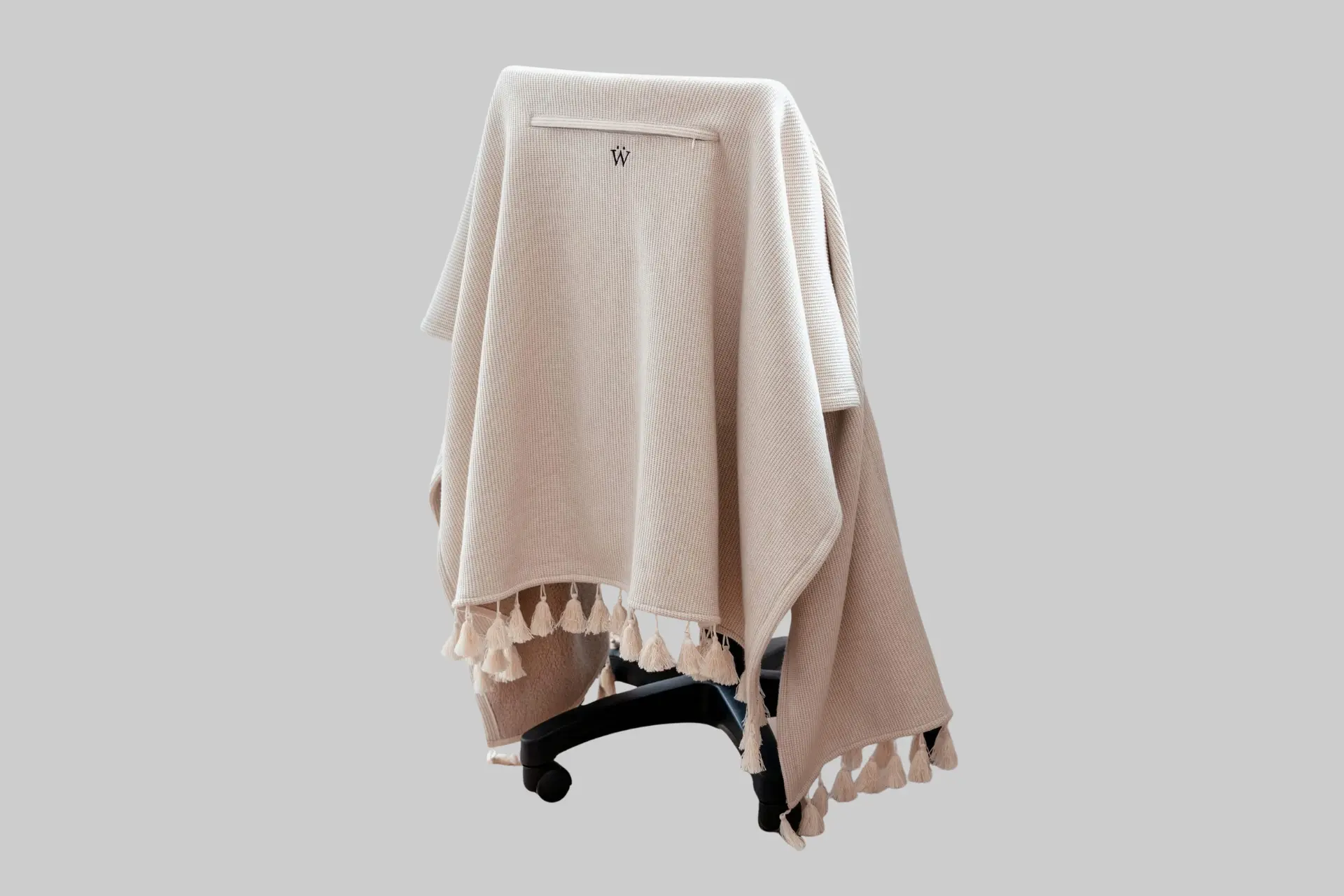 A beige Warmur Office Chair Blanket draped seamlessly over a modern office chair, showcasing its tailored fit and cozy texture. - Product Review
