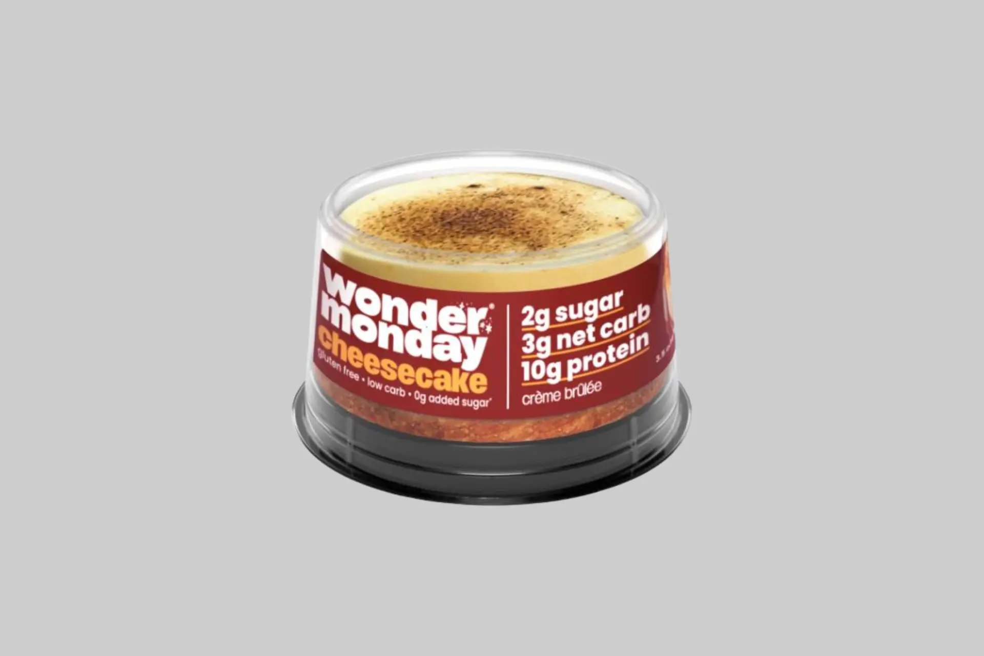 WONDER MONDAY Crème Brûlée Keto Cheesecake with caramelized topping served on a dessert plate.