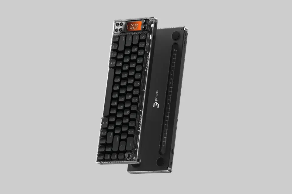 Work Louder Nomad [E] v2 mechanical keyboard in a modern desk setup, highlighting its integrated IPS display and rotary knobs. - Product Review