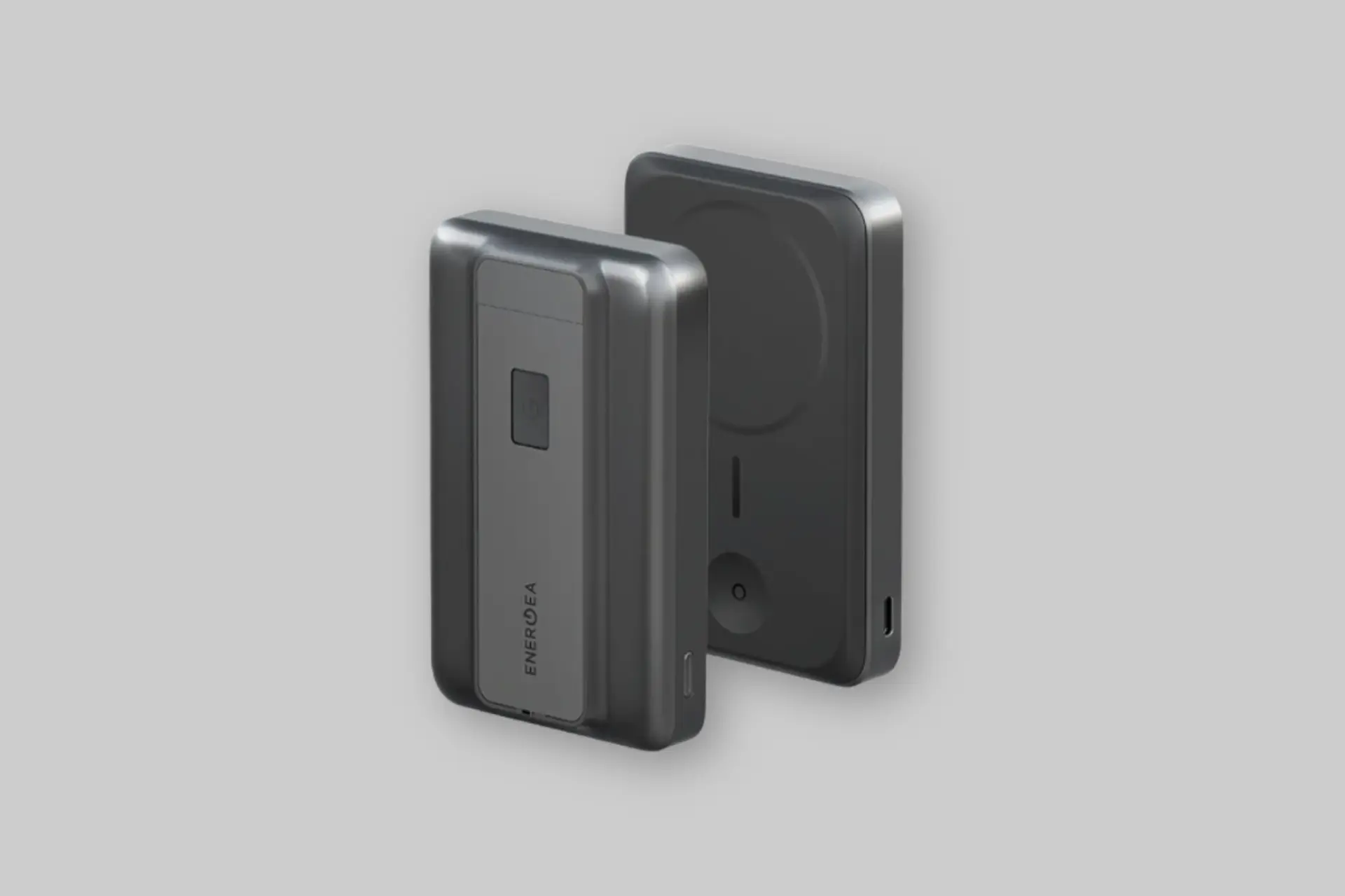 The ENERGEA MagPac Pro 35S, a sleek black 10000mAh hybrid solid-state power bank, magnetically attached to an iPhone, with an Apple Watch charging simultaneously. - Product Review
