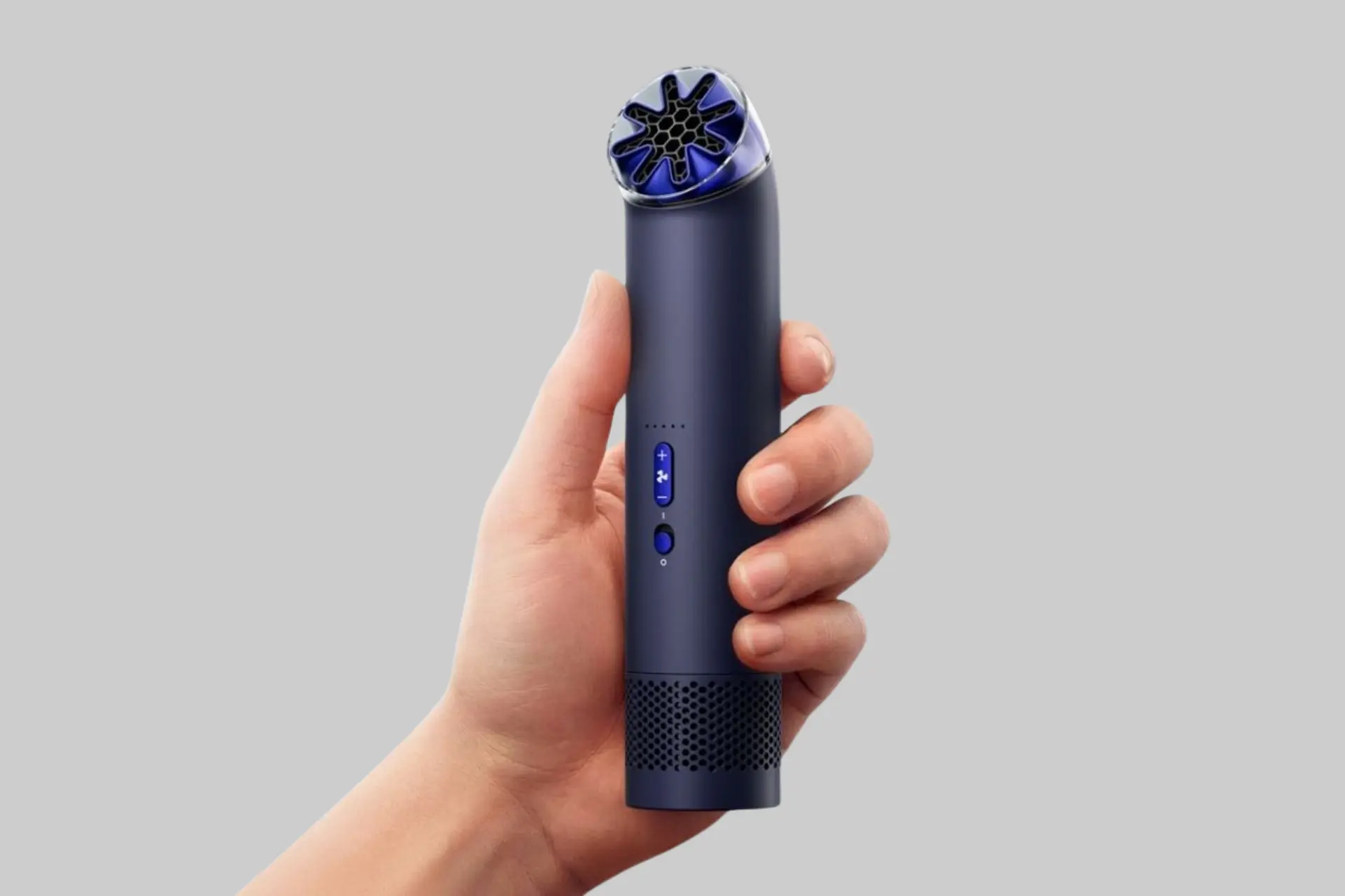 Dyson HushJet Mini Cool portable fan in handheld mode, showcasing its compact bladeless design, adjustable nozzle, and premium Dyson construction. - Product Review