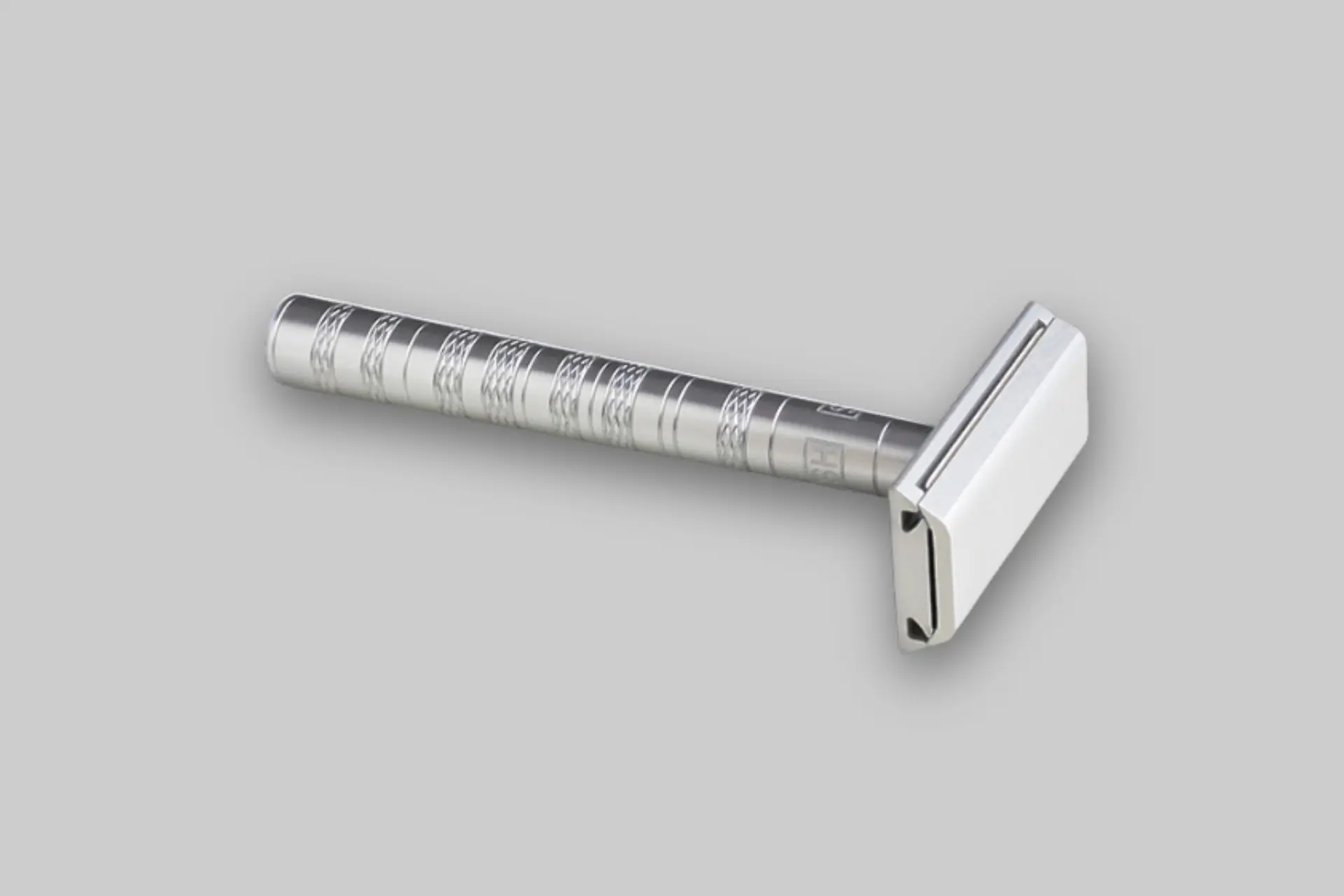 Henson AL13 Aircraft Aluminum Safety Razor in a sleek matte finish, showcasing its minimalist design and precise engineering. - Product Review