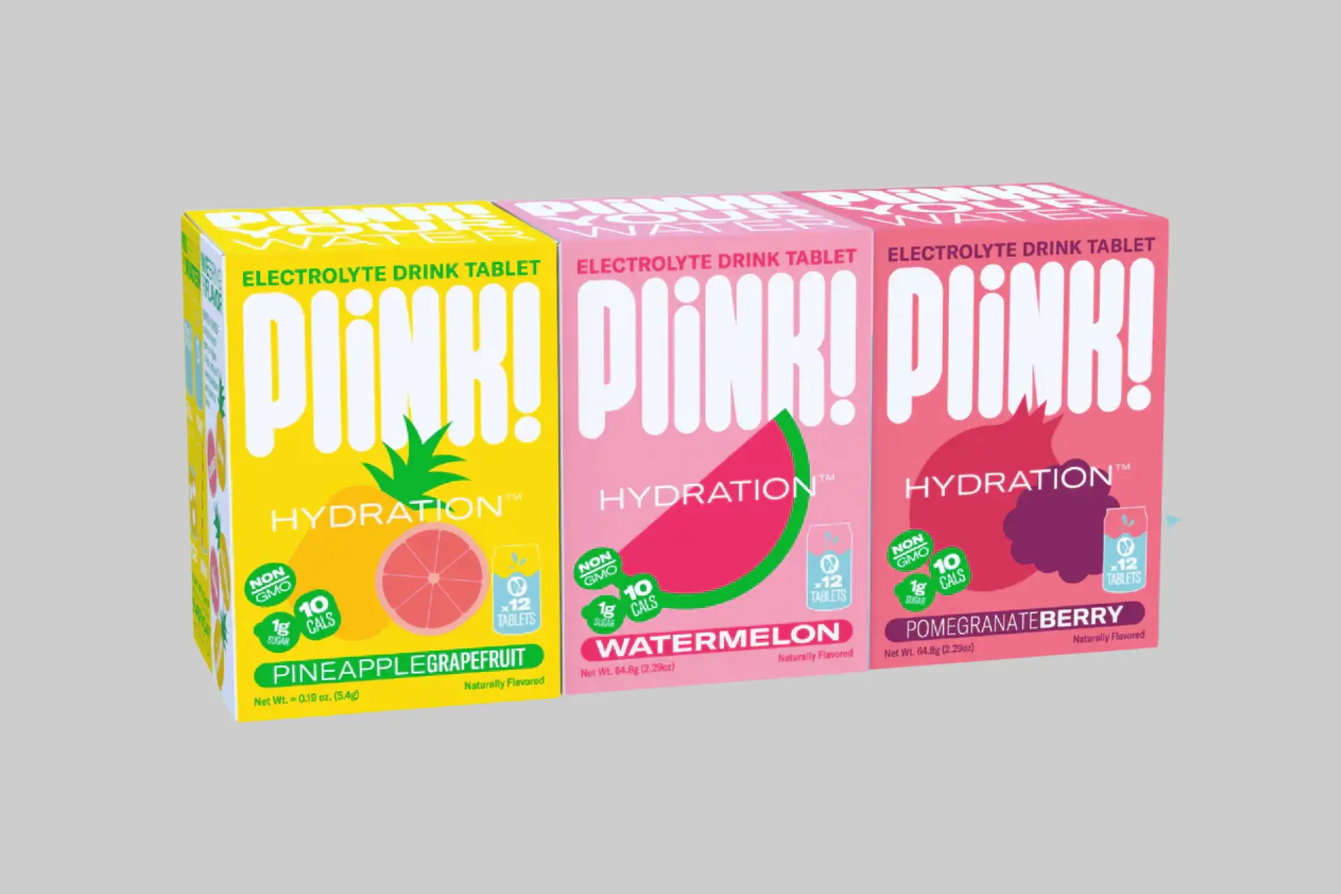 A glass of water with a Plink! effervescent tablet dissolving, surrounded by various fruit ingredients like lemon and raspberry. - Product Review