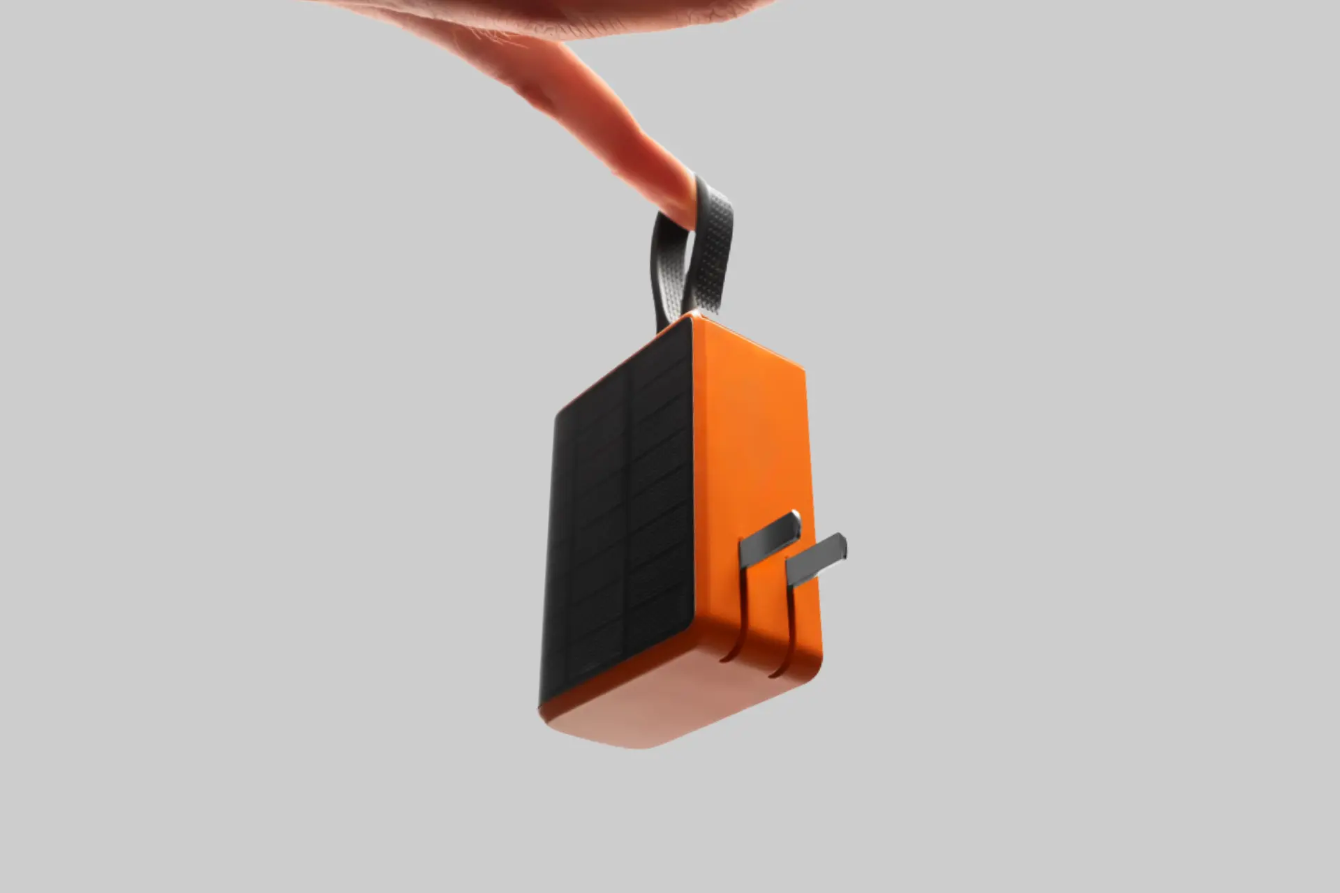 The Solly 280W solar power bank in a compact form, showing the built-in wall plug, dual USB-C ports, and solar panel on its exterior surface. - Product Review