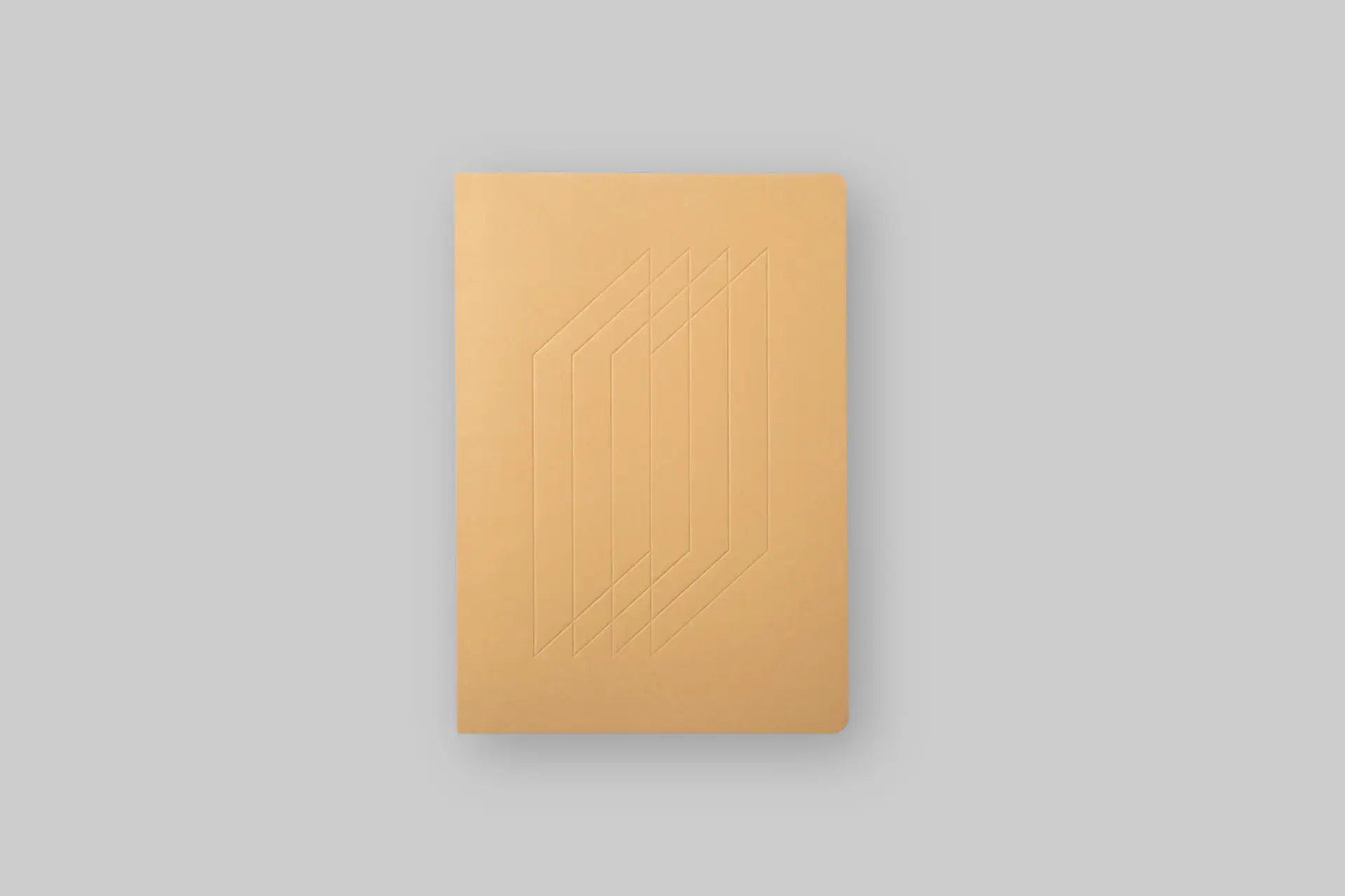 Ugmonk Layflat Notebook in Tan featuring a minimalist embossed cover, dot-grid pages, and Smyth-sewn binding that opens completely flat. - Product Review