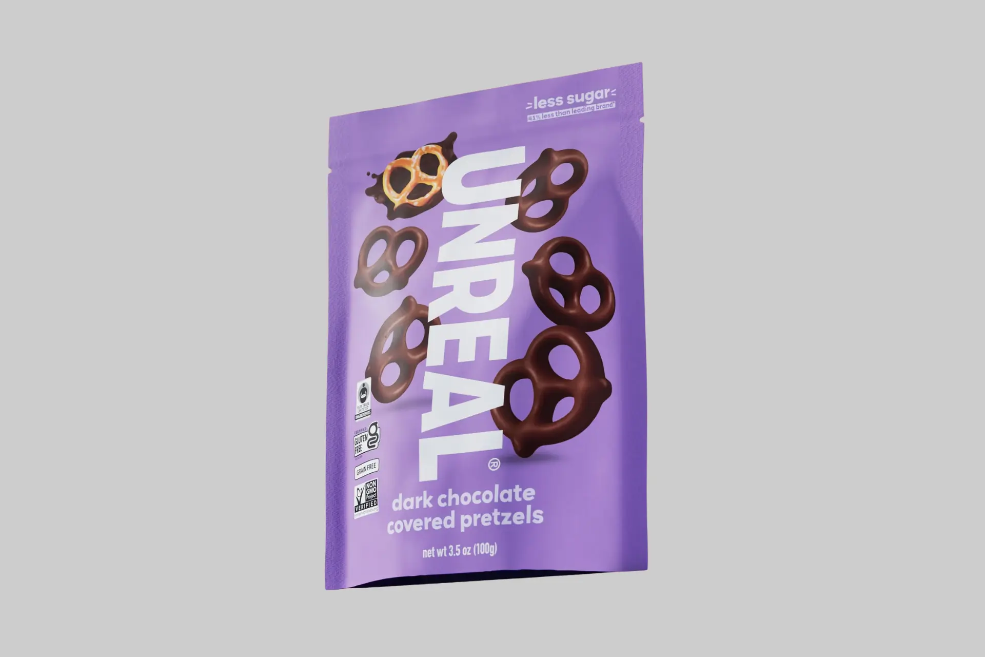 An open bag of Unreal Dark Chocolate Covered Pretzels spilling out onto a surface, showcasing the rich dark chocolate coating and crunchy pretzel texture. - Product Review