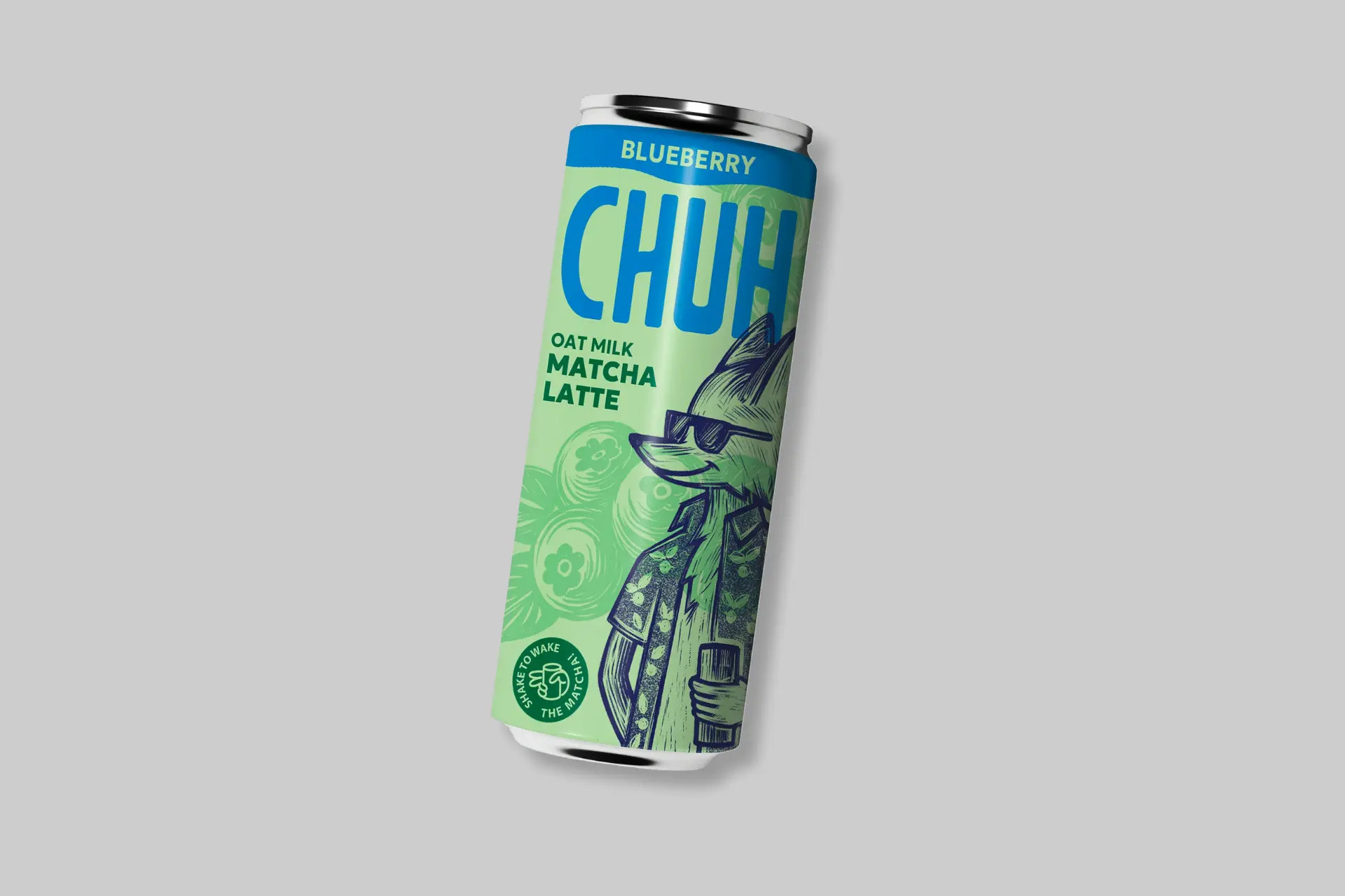 A vibrant can of CHUH Matcha Blueberry Oat Milk latte with a green and blue design, surrounded by fresh blueberries. - Product Review