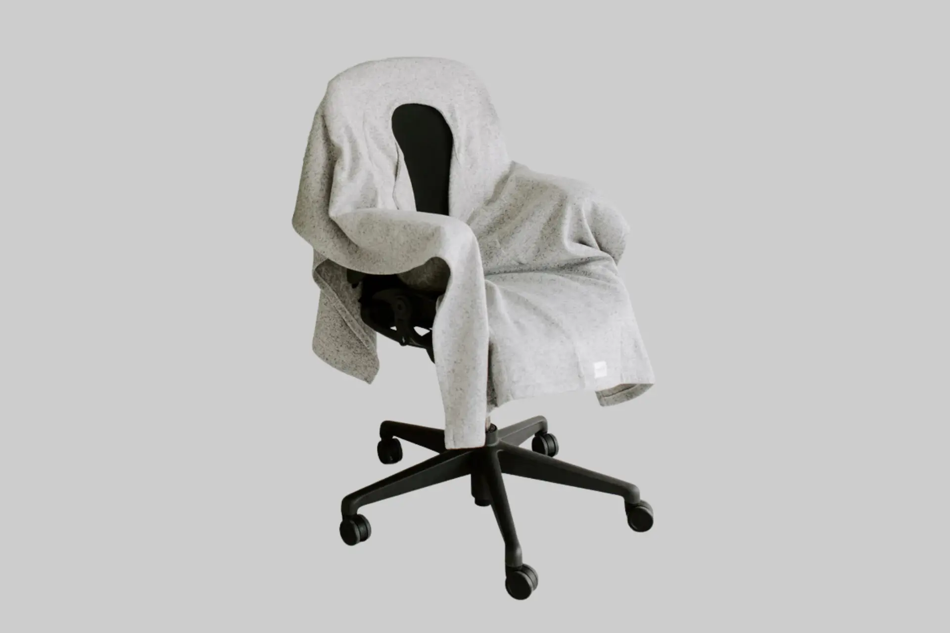A beige Warmur Office Chair Blanket draped seamlessly over a modern office chair, showcasing its tailored fit and cozy texture. - Product Review
